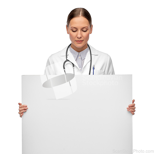 Image of female doctor holding white board