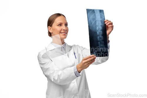 Image of happy smiling female doctor with x-ray of spine