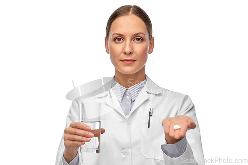 Image of female doctor with medicine and glass of water