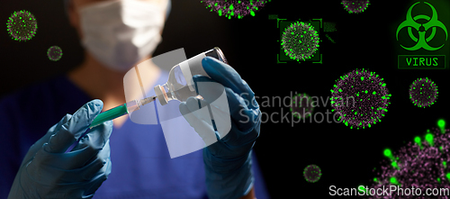 Image of doctor in face mask with syringe and medicine