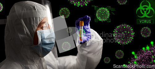 Image of scientist in mask and face shield with test tube
