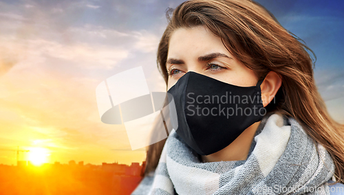 Image of woman wearing protective reusable barrier mask