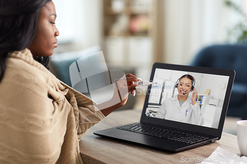 Image of sick woman having video call with doctor on laptop