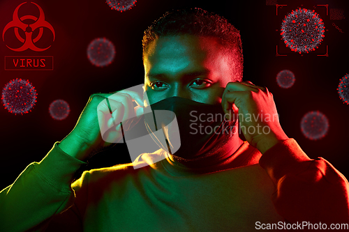 Image of african american man wearing black reusable mask