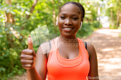 Image of happy african american woman with headphones
