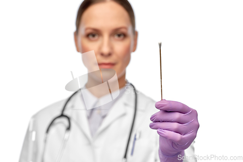 Image of close up of female doctor with cotton swab