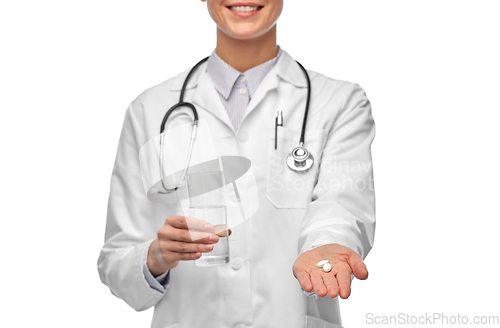 Image of doctor with medicine and glass of water