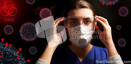 Image of female doctor or nurse in goggles and face mask