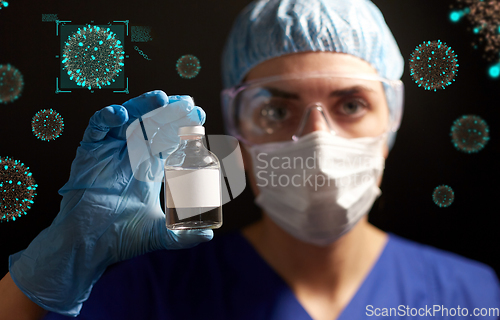 Image of close up of doctor's hand with bottle of medicine