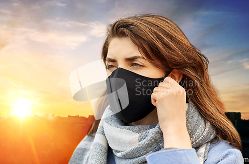 Image of woman wearing protective reusable barrier mask