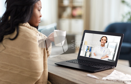 Image of sick woman having video call with doctor on laptop