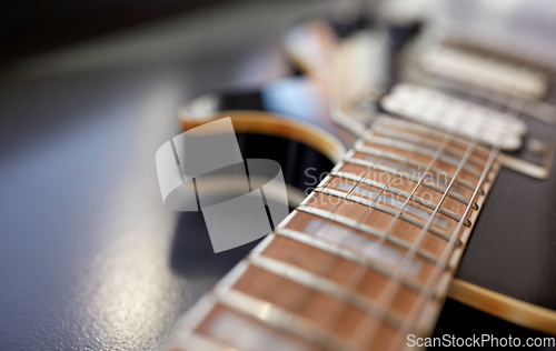 Image of close up of bass guitar neck and strings