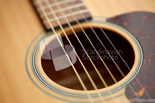 Image of close up of acoustic guitar strings