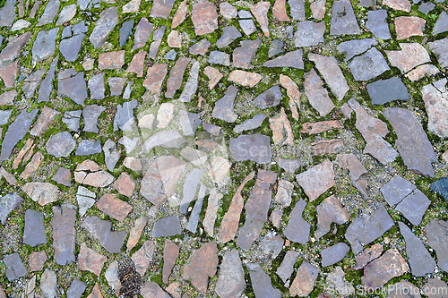 Image of Old pavement of stones of different colors and sizes