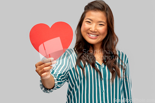 Image of happy asian woman with red heart