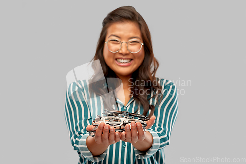 Image of happy asian woman with glasses