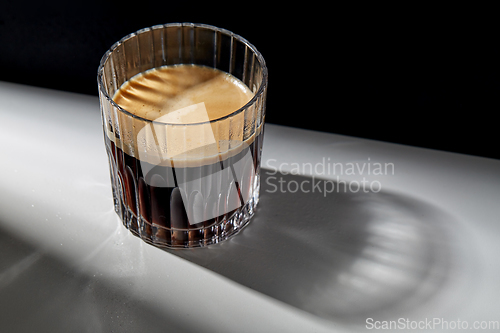 Image of glass of coffee on table