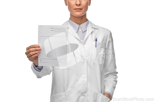 Image of close up of female doctor with prescription blank