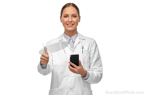 Image of female doctor with smartphone showing thumbs up