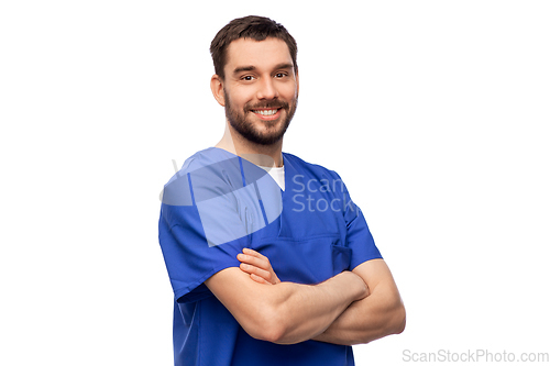 Image of happy smiling doctor or male nurse in blue uniform