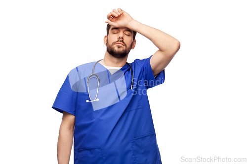 Image of tired doctor or male nurse with stethoscope