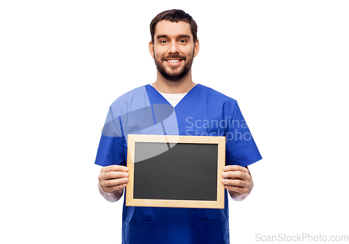 Image of happy smiling male doctor or nurse with chalkboard