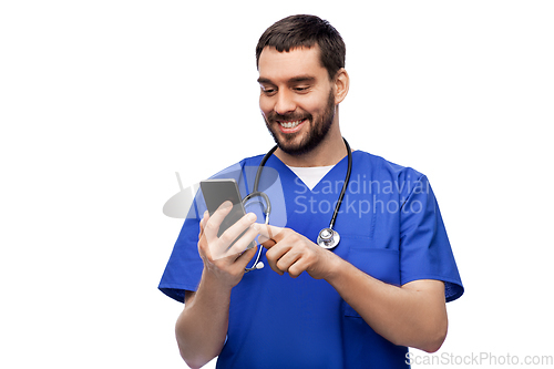 Image of smiling doctor or male nurse using smartphone