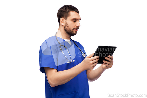 Image of doctor or male nurse using tablet computer