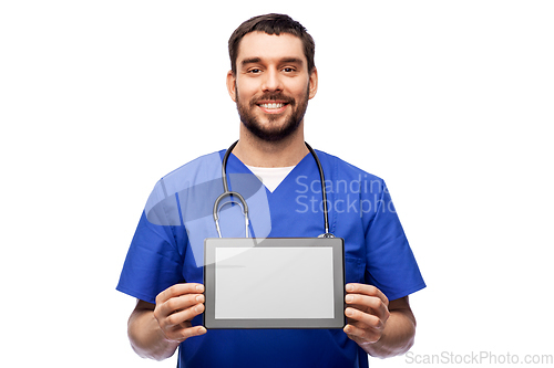 Image of happy doctor or male nurse showing tablet computer