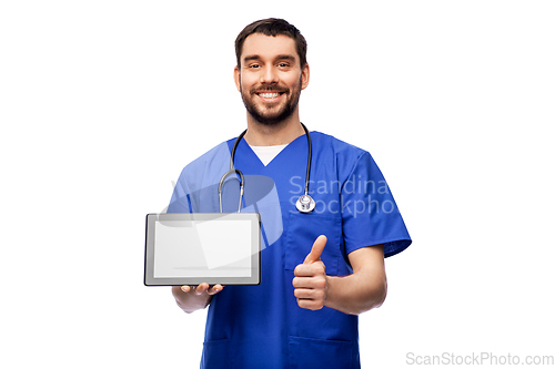 Image of male doctor with tablet pc showing thumbs up