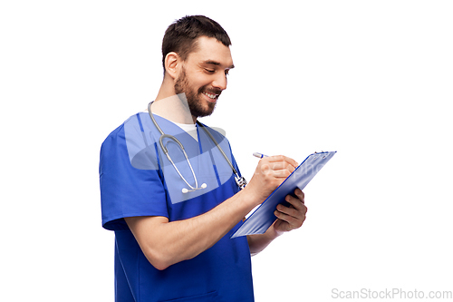 Image of male doctor writing medical report on clipboard