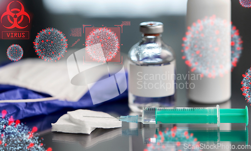 Image of syringe with medicine over coronavirus virions