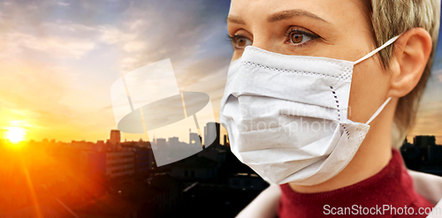 Image of young woman wearing protective medical mask