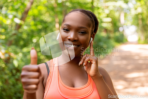 Image of happy african american woman with headphones