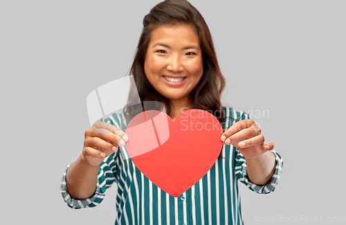 Image of happy asian woman with red heart