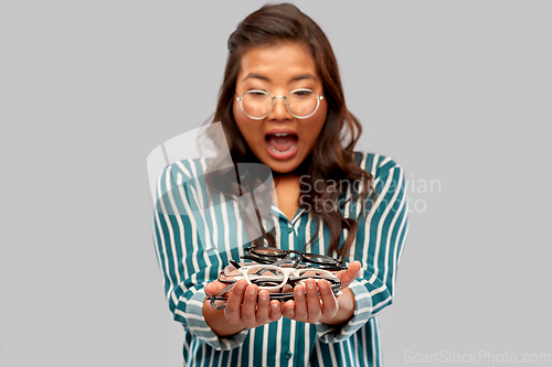 Image of surprised asian woman with glasses