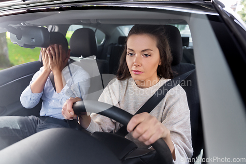 Image of car driving school instructor teaching woman