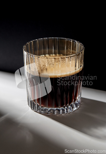 Image of glass of coffee on table