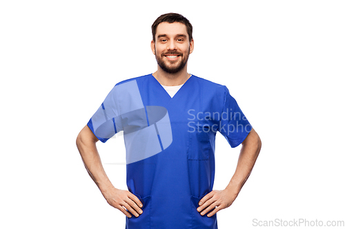 Image of happy smiling doctor or male nurse in blue uniform