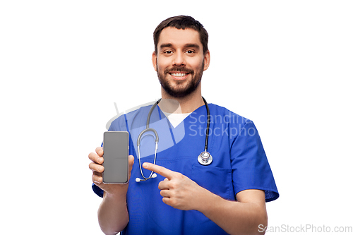 Image of smiling doctor or male nurse with smartphone