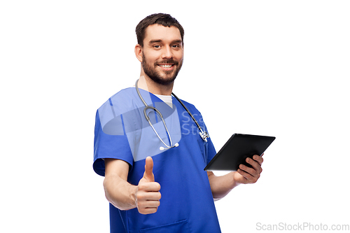 Image of male doctor with tablet pc showing thumbs up