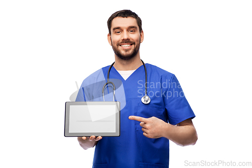 Image of happy doctor or male nurse showing tablet computer