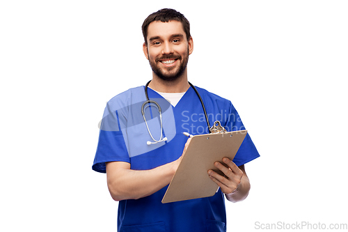 Image of male doctor writing medical report on clipboard