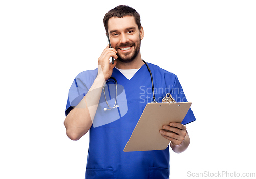 Image of smiling doctor or male nurse calling on smartphone