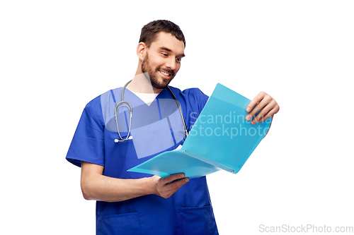 Image of happy male doctor reading medical report in folder
