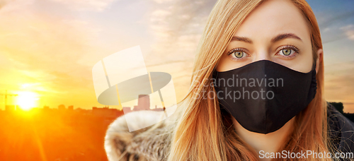 Image of woman wearing protective reusable barrier mask