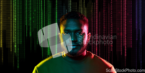 Image of young african american man over binary code