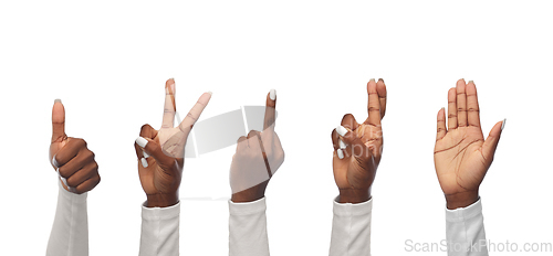 Image of hands of african woman showing various gestures