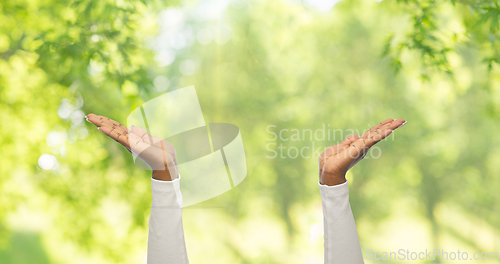 Image of close up of african american woman clapping hands