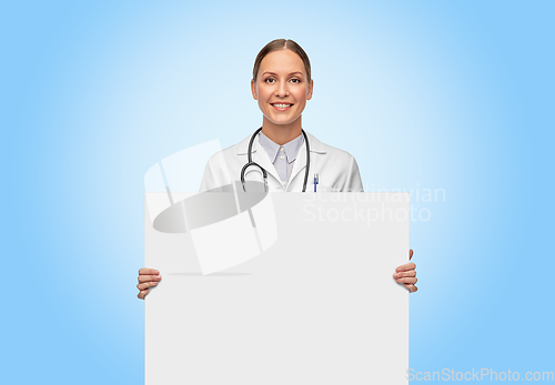 Image of happy smiling female doctor holding white board